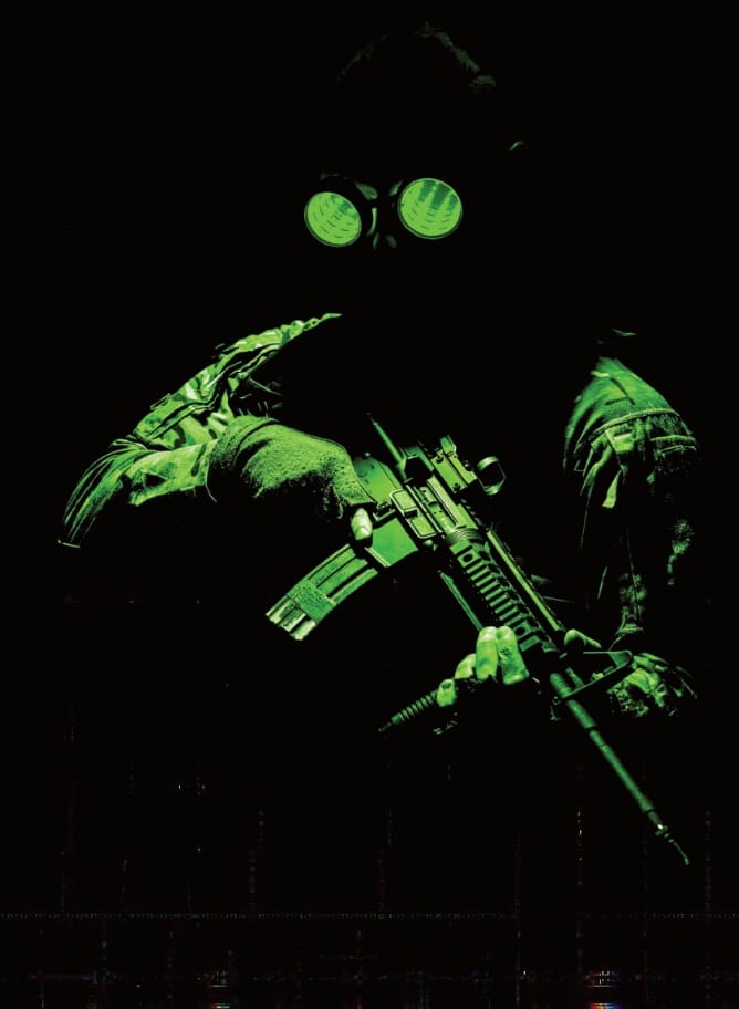 A futuristic soldier with huge glasses and a modern assault rifle